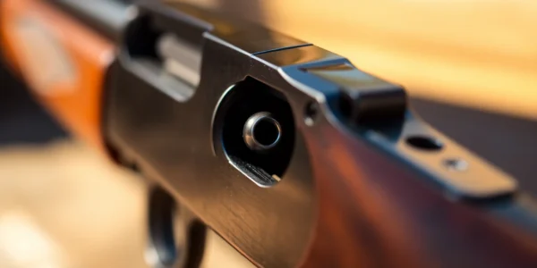 A detailed shot highlighting the 32 WIN in a classic Winchester rifle, focusing on craftsmanship and historical firearms appeal.